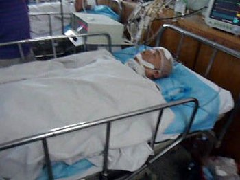 Го Хуейшень знаходиться в комі після побиття в поліцейській дільниці. Фото з minghui.org 