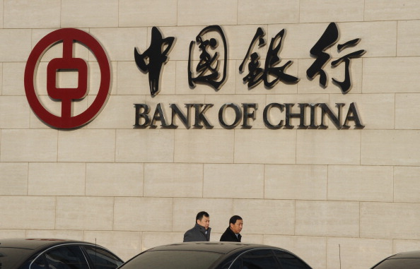 Народний банк Китаю стимулює інертну економіку, зменшуючи відсоткові ставки. Фото: MARK RALSTON/AFP/Getty Images