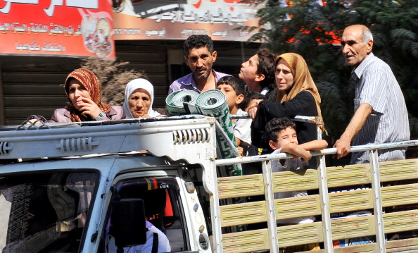 Сирійці масово покидають Алеппо, 26 липня. Фото: BULENT KILIC/AFP/GettyImages