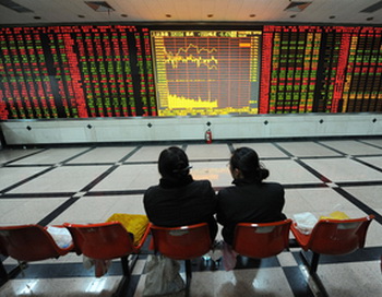 По словам Алана Гринспана, экономическое благосостояние Китая - «нерациональное преувеличение». Foto: STR/AFP/Getty Images