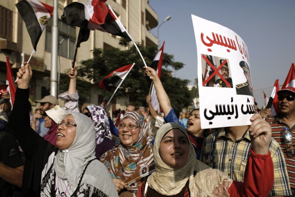 Египтяне на акции протеста против политики Мухамеда Мурси, 3 июля, Каир. Фото: Ed Giles/Getty Images