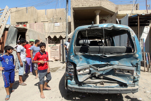 Один из взорванных автомобилей в Ираке, 29 июля. Фото: AHMAD AL-RUBAYE/AFP/Getty Images