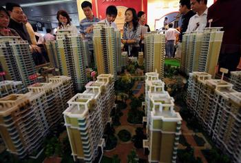 Китайская компартия развивает города, увеличивая расслоение общества. Фото: China Photos/Getty Images