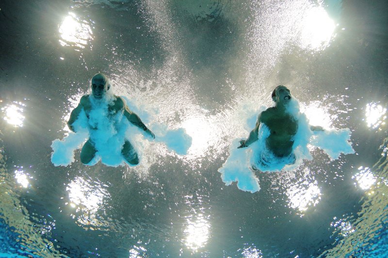 Лондон, Англія, 30 липня. Олімпійські Ігри 2012. Британські атлети Томас Дейлі (праворуч) та Пітер Вотерфілд змагаються в стрибках у воду з 10-метрової синхронної вишки. Фото: Adam Pretty/Getty Images 