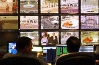 Банки телевизионных станций в Китае просматриваются на содержание трансляций. Фото: Kristy Wigglesworth/AFP/Getty Images