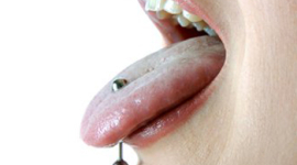 Ученые: пирсинг языка разрушает зубы