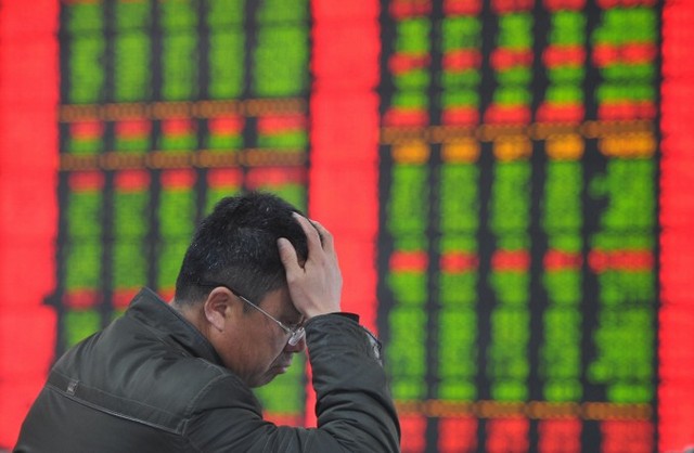 Реакція біржового інвестора на вартість акцій у фірмі, яка веде операції із цінними паперами у м. Фуян китайської провінції Аньхой, 19 січня 2015 року